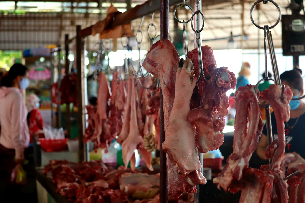 meat hanging in an open air market